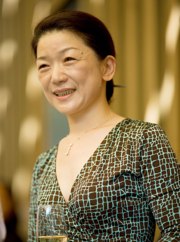 Kenzo Estate co-owner and COO Natsuko Tsujimoto Lady holds a wine glass