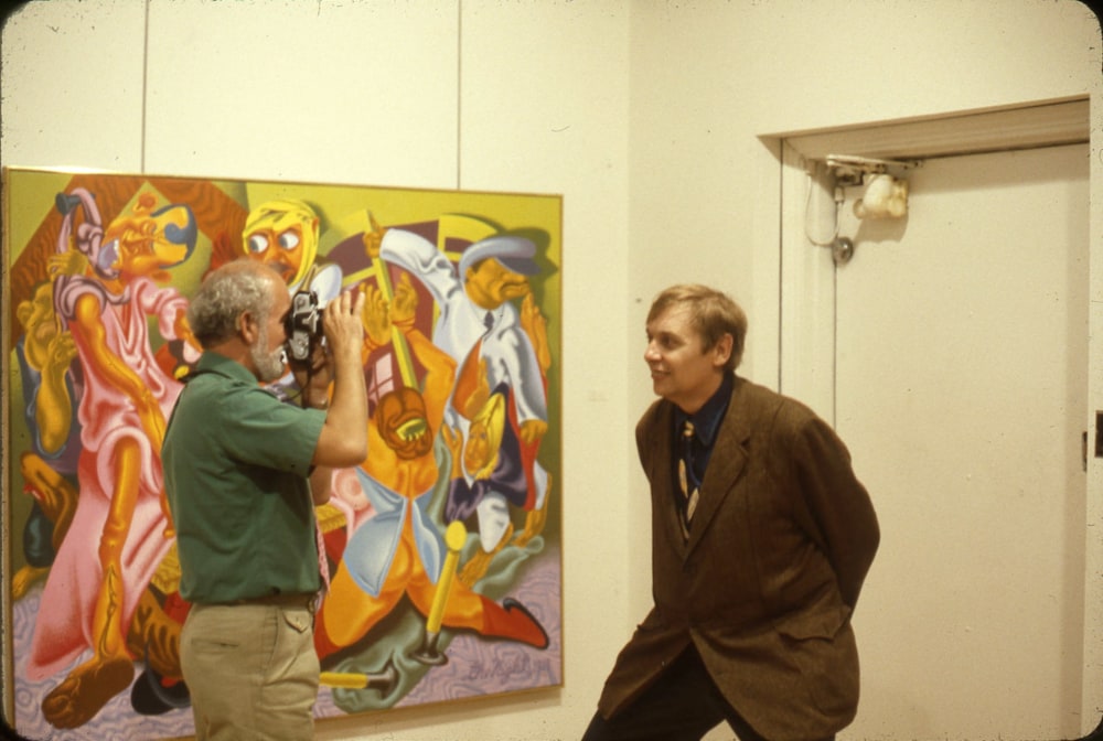 Robert Arneson and Jack Beal in front of Peter Saul&amp;rsquo;s Beckmann&amp;rsquo;s &amp;lsquo;The Night, 1918&amp;rsquo;, May 1979.

Image courtesy the George Adams Gallery Archives.