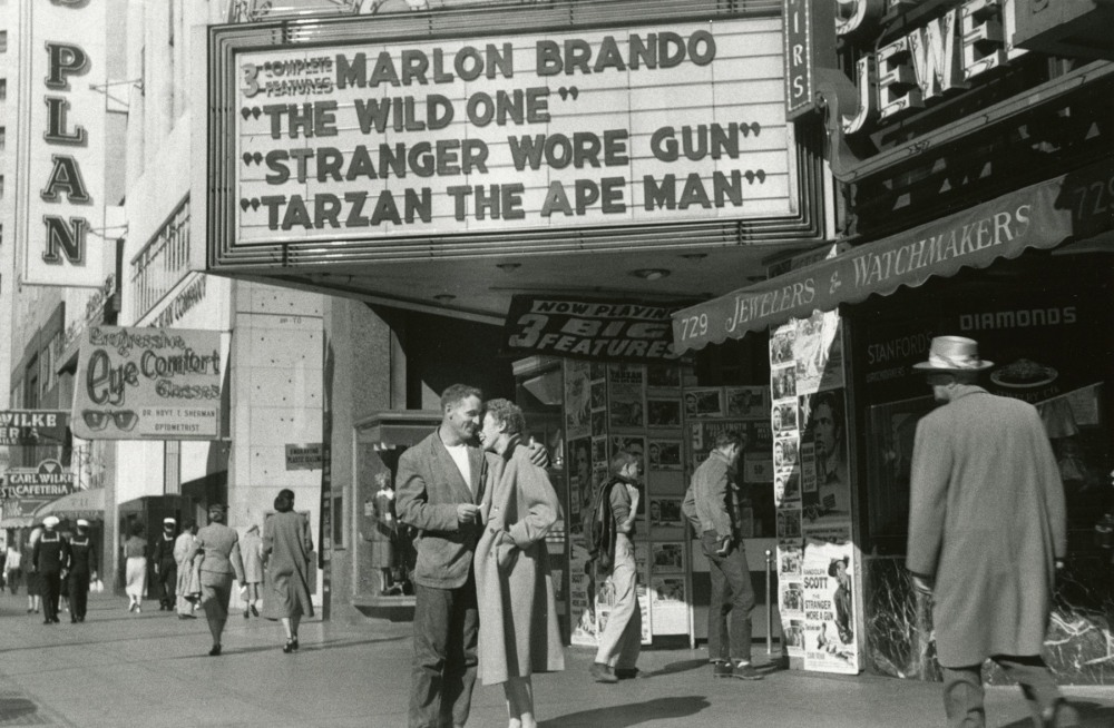 Neal Cassidy and Natalie Jackson conscious of their roles in Eternity, Market Street, San Francisco, 1955