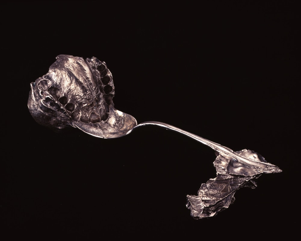 Janine Antoni, Umbilical, 2000, Sterling silver cast of family silverware and negative impression of artist&amp;#39;s mouth and mother&amp;#39;s hand, 8 x 3 x 3 inches (20.32 x 7.62 x 7.62 cm),&amp;nbsp;Edition of 35 and 6 APs
&amp;nbsp;