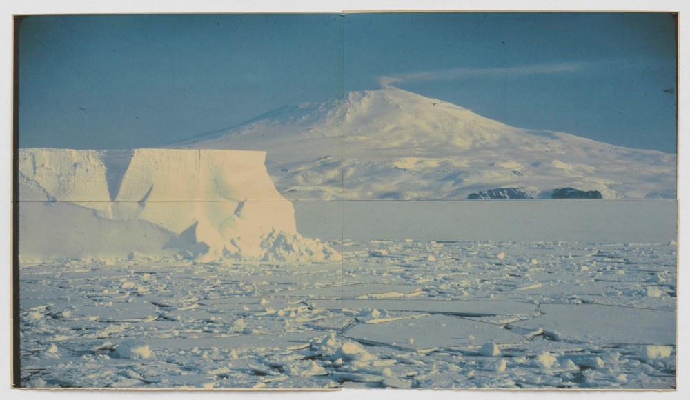 Snow scene with iceberg and mountain, set in a snow covered lake