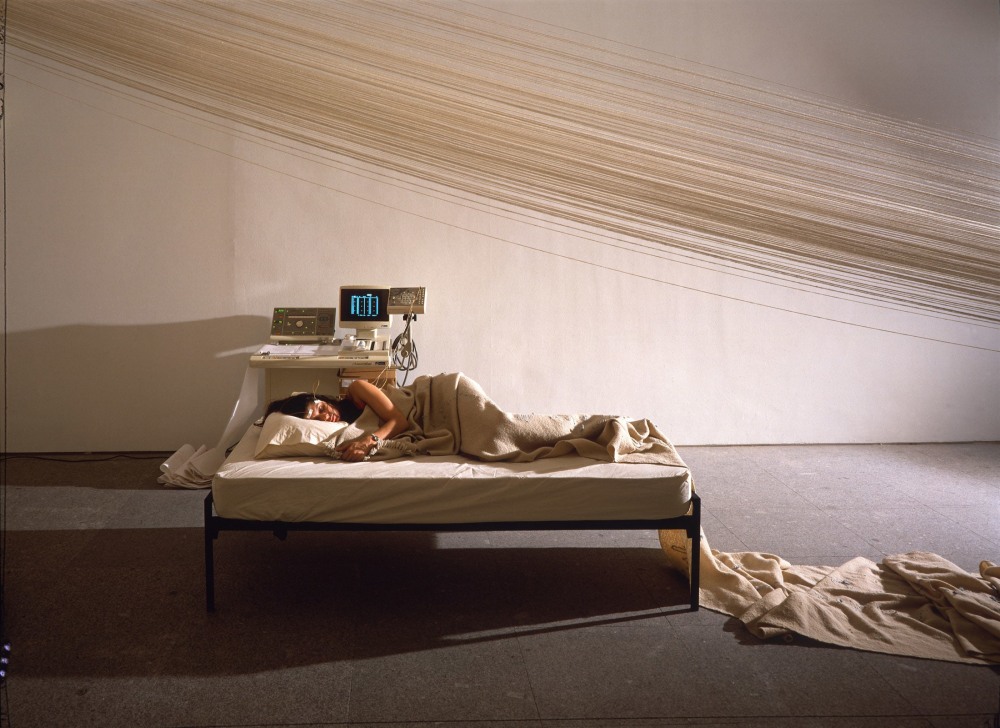 Janine Antoni, Slumber, 1993, Performance with loom, yarn, bed, nightgown, polysomnogram machine and artist&amp;rsquo;s REM reading, Dimensions variable