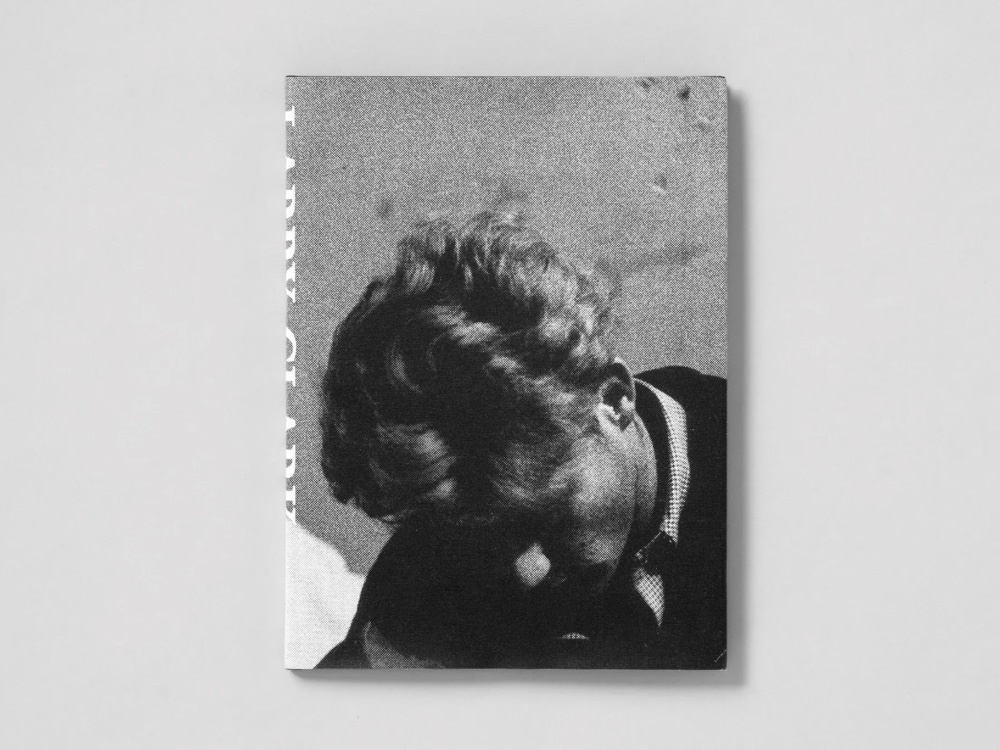 Cover of Larry Clark book: black and white photograph of a young man looking down