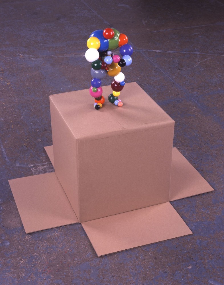 ball sculpture on cardboard box