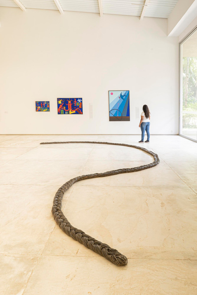 Gallery installation shot of braided rope sculpture on floor