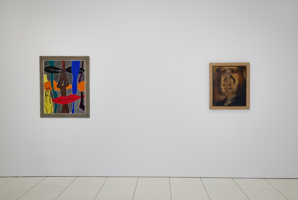 Installation view of a painting by Man Ray and a painting by Francis Picabia