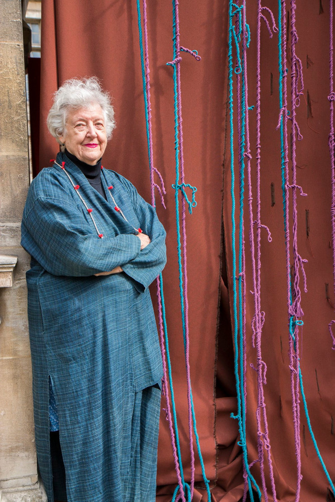 Portrait of Sheila Hicks with arms folded