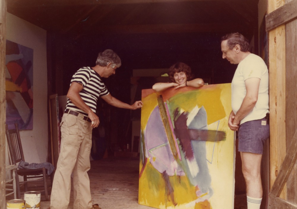 Mason standing behind one of her works in progress alongside
Wolf Kahn (left) and Martin Ackerman (right),
ca. late 1970s/early 1980s.
© 2025 Emily Mason | Alice Trumbull Mason Foundation/ARS. 