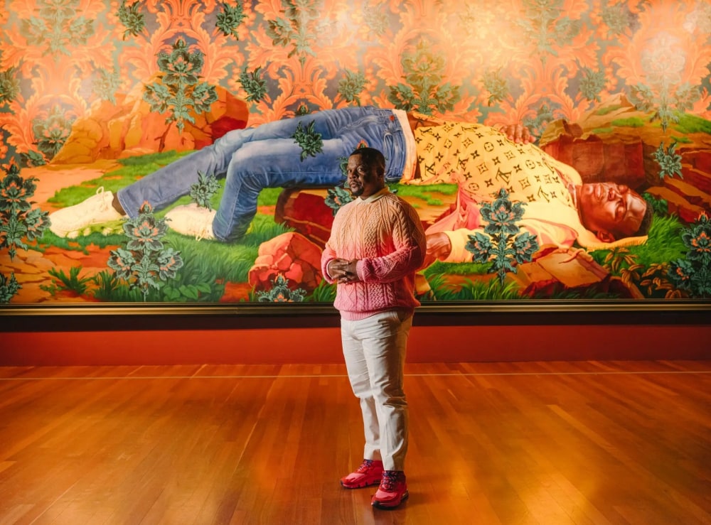 Kehinde Wiley at “An Archaeology of Silence” at the de Young Museum in San Francisco with his monumental 2022 painting, “Femme piquée par un serpent (Mamadou Gueye).” 