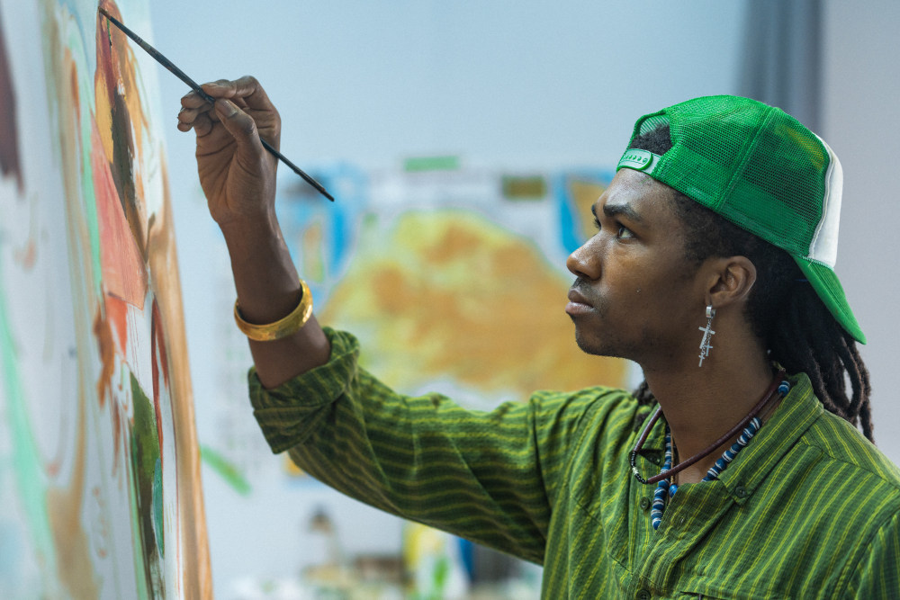 Image: Devin Johnson painting in his studio, Black Rock © 2020. Courtesy of Kehinde Wiley and Black Rock Senegal. Photographer: Abdoulaye Ndao