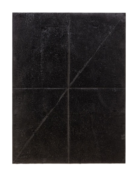 a piece of paper coved in tar then folded