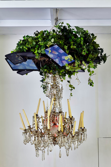 , NAM JUNE PAIK&nbsp;Video Chandelier No. 4,&nbsp;1990&nbsp;Video monitors, chandelier, candles, tree leaves&nbsp;59 x 59 x 59 in. (150 x 150 x 150 cm)