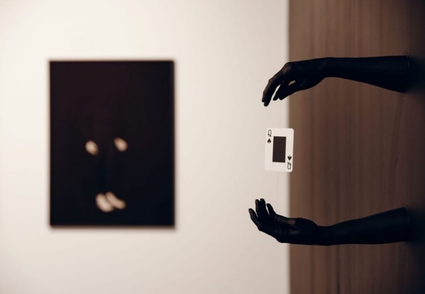 NATASCHA NIEDERSTRASS | INSTALLATION VIEW | SANS TITRE (LÉVITATION D'UNE DAME) | HYDROSTONE, CLEAR WIRE, PLAYING CARD, BLACK LATEX PAINT | 18 X 15 X 15 INCHES | 2022-2023