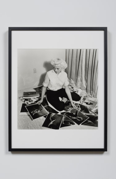 Bunny Self Portrait Viewing Photographs, Miami, FL, 1959