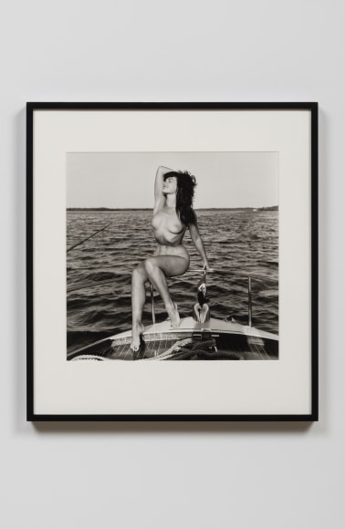 Bettie Page on Chris Craft with Hand Behind the Head, 1954