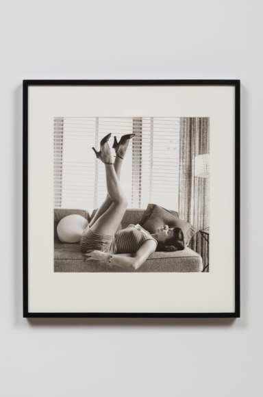 Bettie Page Reclining on Sofa at Coral Gables, FL, 1954