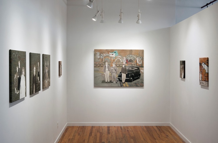 Sue Stone installation of embroidery artworks in room