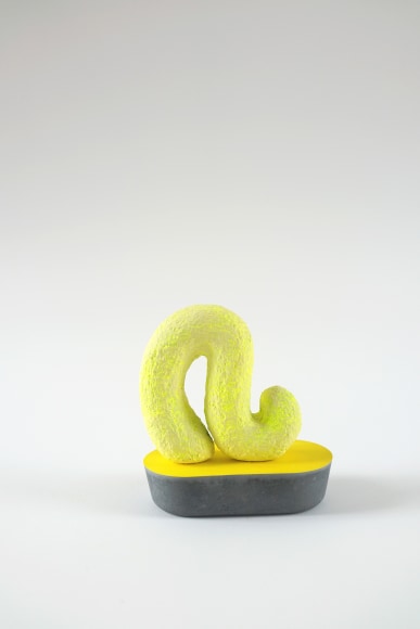 Chiaozza ​Slinking Glow Wiggle, 2019 Acrylic on paper pulp and  pigmented concrete 4 &frac12; x 4 &frac12; x 2 &frac34; in. / 11.4 x 11.4 x 7 cm.