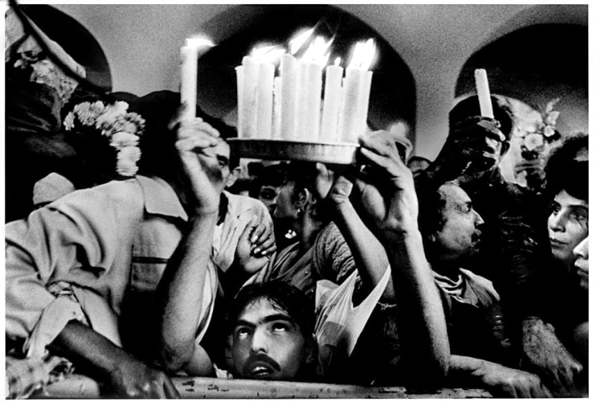 Devotee offering candles to Saint Lazarus, Santiago de las Vegas, 1995 - Ernesto Bazan