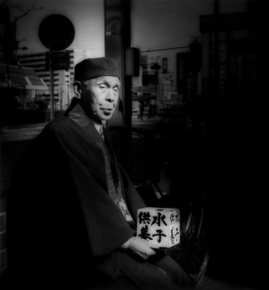 Scrutinized by fortuneteller, Sugamo, Tokyo, Japan, 1995 - Mangaland | James Whitlow Delano Documentary Photography