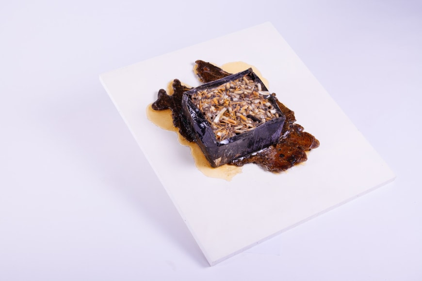 Farhi&#039;s Ashtray,&nbsp;1966, Accumulation of cigarette butts and matches in an ashtray, covered with polyester on wood panel