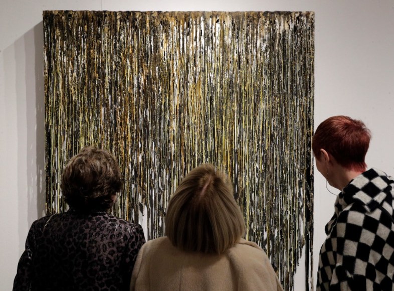 Linda Vaughn (left), Jane Jackson and Freda Scott look at &ldquo;Storms of Gold,&rdquo; by Diana Al-Hadid, which is one of the art pieces featured at the Fog Design + Art fair in the Fort Mason Festival Pavilion in San Francisco.Photo: Carlos Avila Gonzalez / The Chronicle
