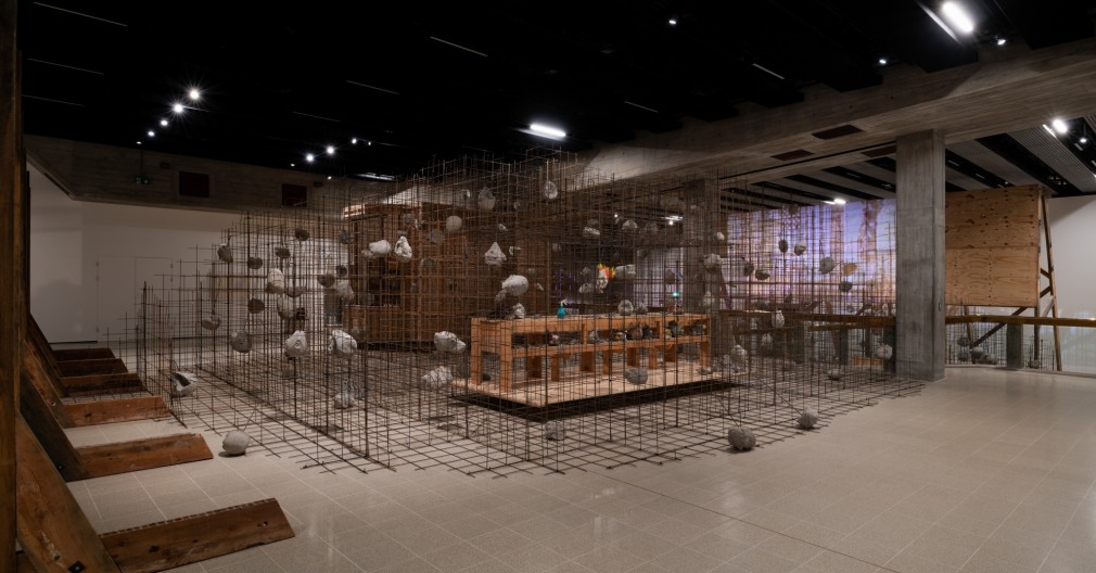 Installation view of Mike Nelson, Studio Apparatus for Kunsthalle Münster - A Thematic Instalment Observing the Calendrical Celebration of its Inception: Introduction; towards a linear understanding of notoriety, power, and their interconnectedness; futurobjecs (misspelt);mysterious island* *see introduction or Barothic shift, 2014. Various materials. Photo: Matt Greenwood., Courtesy the artist and the Hayward Gallery.