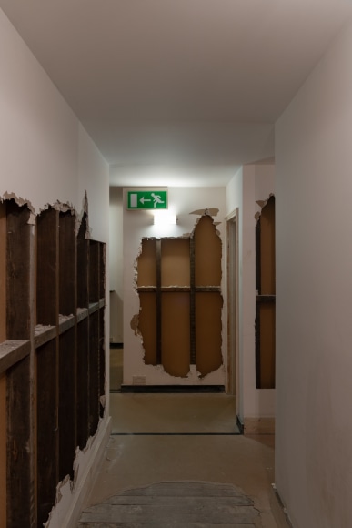 Installation view of Mike Nelson, The Deliverance and, The Patience, 2001. Various materials. Various materials. Photo: Matt Greenwood. Courtesy the artist and the Hayward Gallery.
