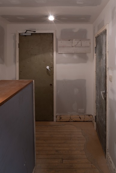 Installation view of Mike Nelson, The Deliverance and, The Patience, 2001. Various materials. Various materials. Photo: Matt Greenwood. Courtesy the artist and the Hayward Gallery.