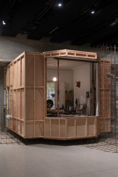 Installation view of Mike Nelson, Triple Bluff Canyon (the projection room), 2004. Various materials., Photo: Matt Greenwood. Courtesy the artist and the Hayward Gallery.