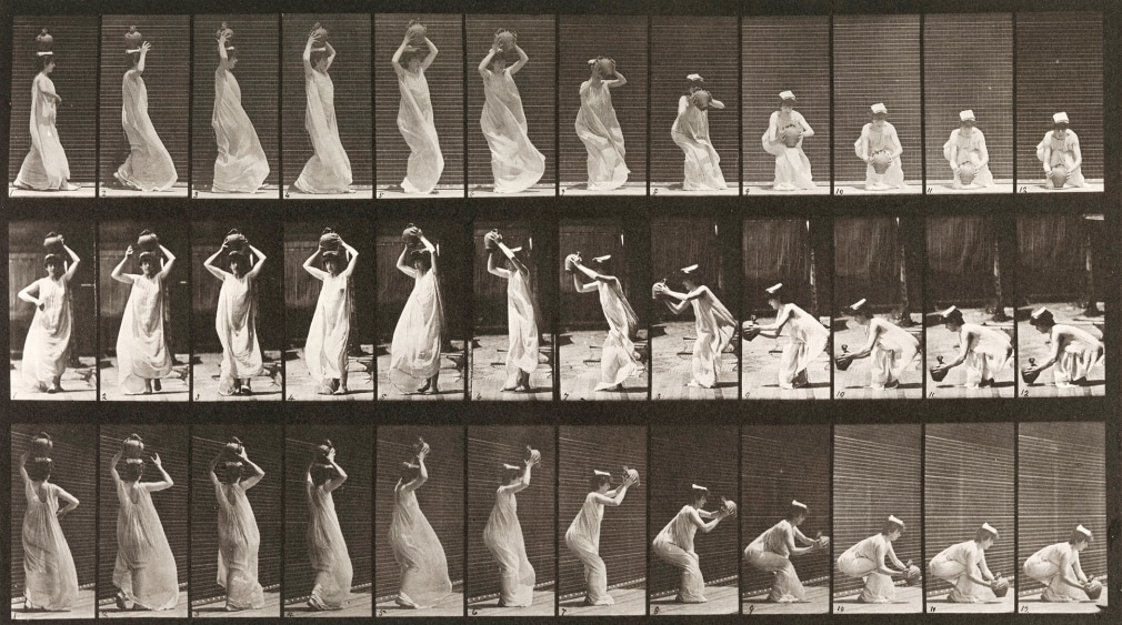 Sequence of black and white images showing movements of a woman carrying water-jar on her head, turning and placing it on the ground