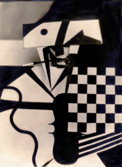 Vintage black and white photo of a man in a checkered cubist stage costume