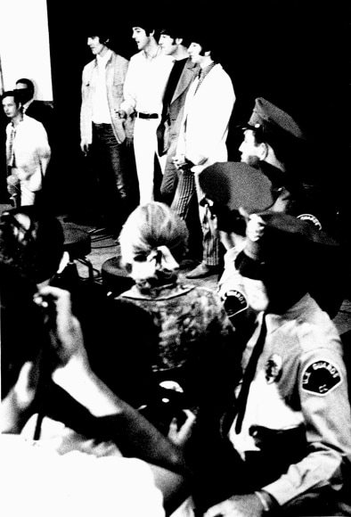 Black and white image from a Beatles press conference in 1966