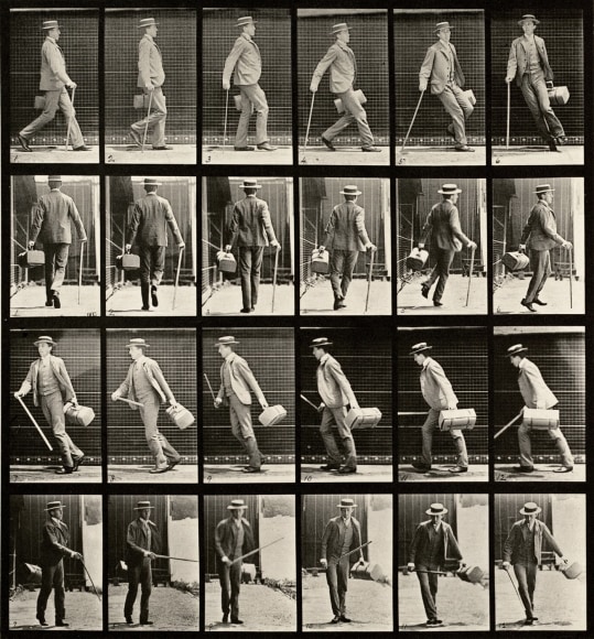 Sequence of black and white photos showing the movements of a man in a suit and a hat, carrying a cane and and a case, as he walks and turns around.