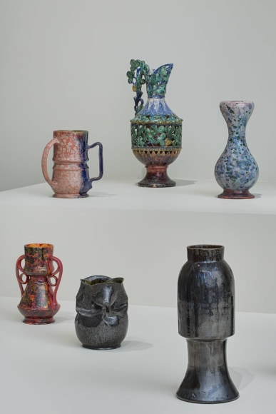 Installation view of George Ohr Pottery: No Two Alike on view at Craig F. Starr Gallery