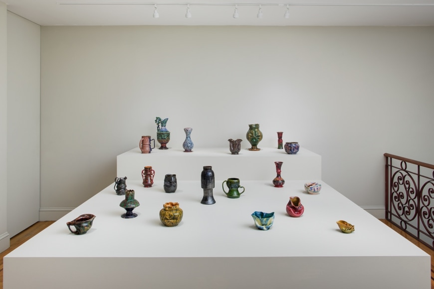 Installation view of George Ohr Pottery: No Two Alike on view at Craig F. Starr Gallery