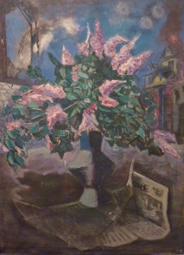 Bouquet of lilacs in a dark, geometric vase sitting on a newspaper. In the background is a dark, twilight night sky, and to the right you can see muted red house with a yellow top which appears to be on fire. To the left there is a sweeping grey and white stripe of rough color.