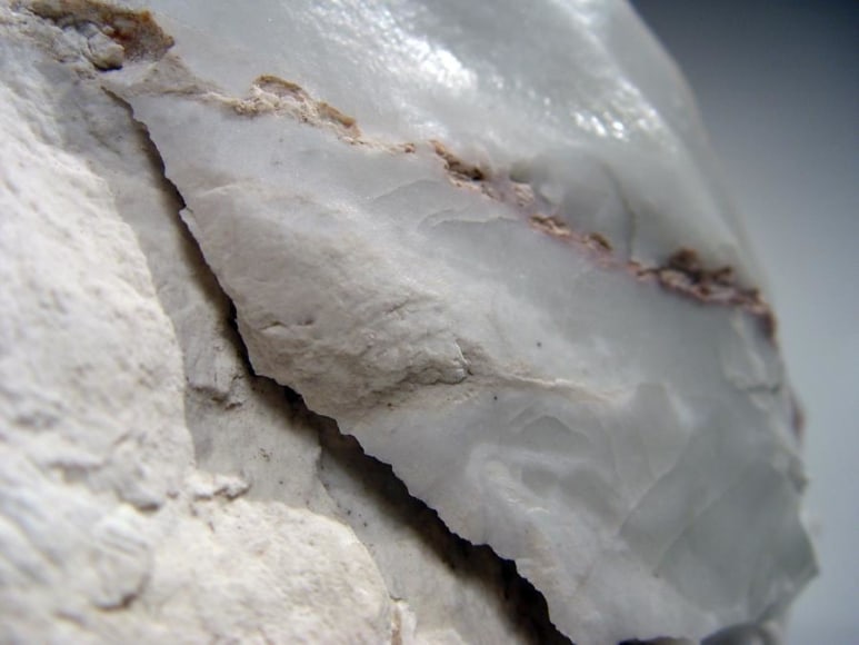 Abstract sculptural form that has been &ldquo;excavated&rdquo; from a larger form with molten glaze in pale green, molten exterior and rough powdery glazed interior, ca.2000-2005