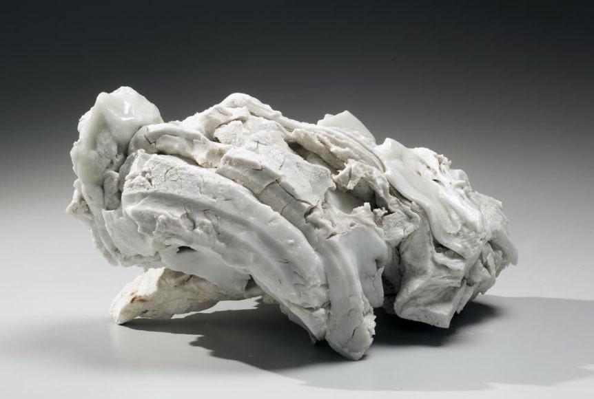 Abstract sculptural form that has been &ldquo;excavated&rdquo; from a larger form with molten glaze in pale green, ca. 2000-2005