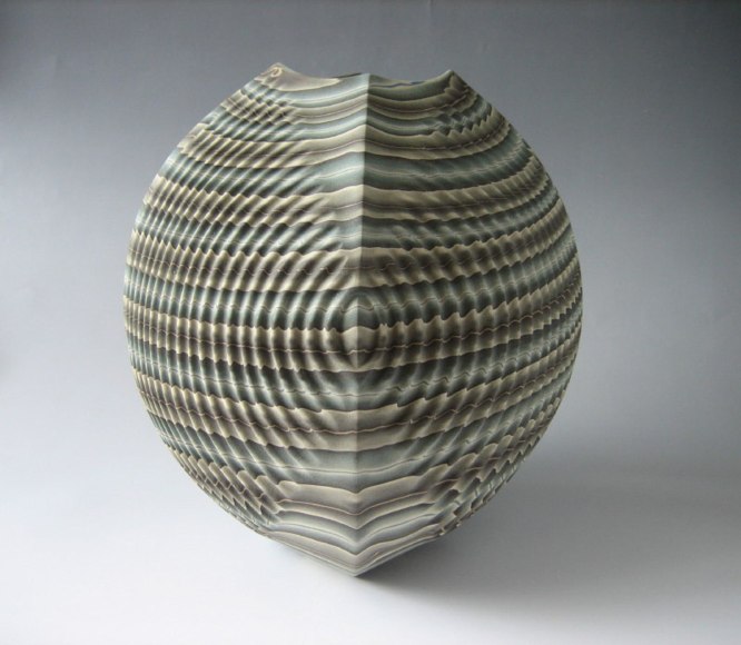 Four-sided sharp-edged, rounded neriage (marbleized) vessel with square base