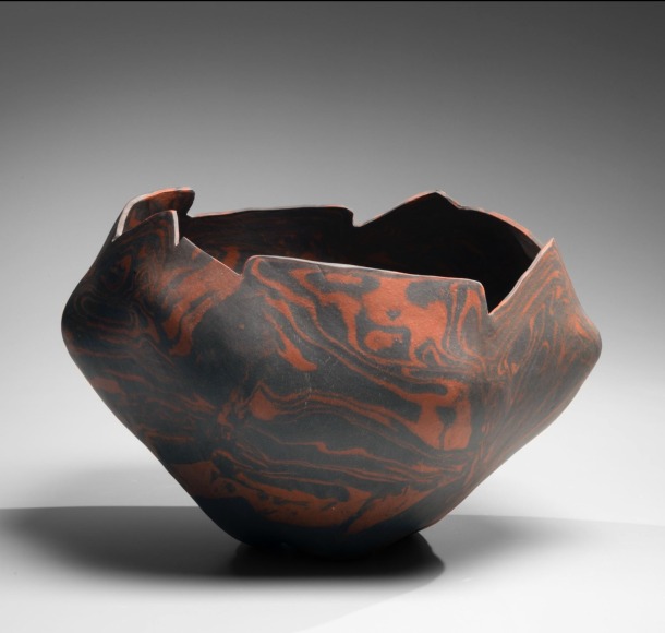 Black and burnt red neriage (marbleized) irregularly shaped sculpture with rugged cut mouth, 2016