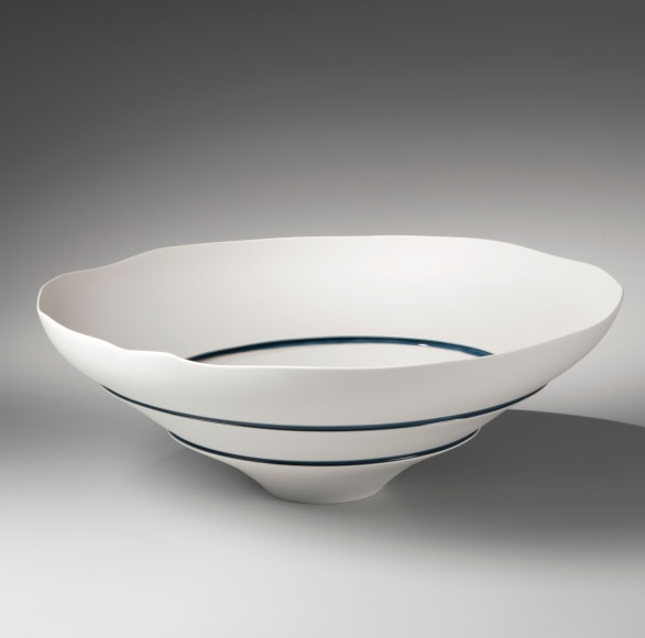 Unglazed narrow-footed bowl cut in three sections and joined together by bands of blue&nbsp;, 2014