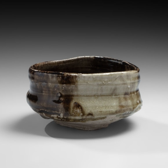Black Oribe-glazed, clog-shaped (kutsu) teabowl in the Momoyama style