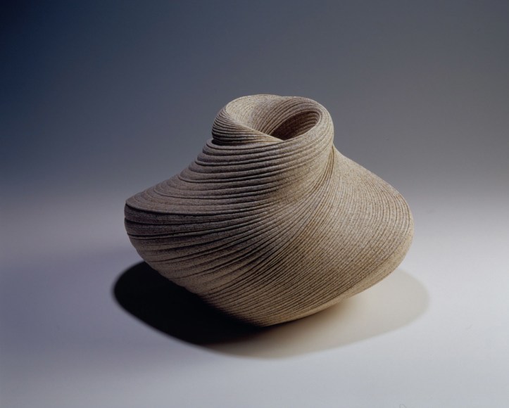 Large vessel with tapered neck with diagonally incised cascading folds
