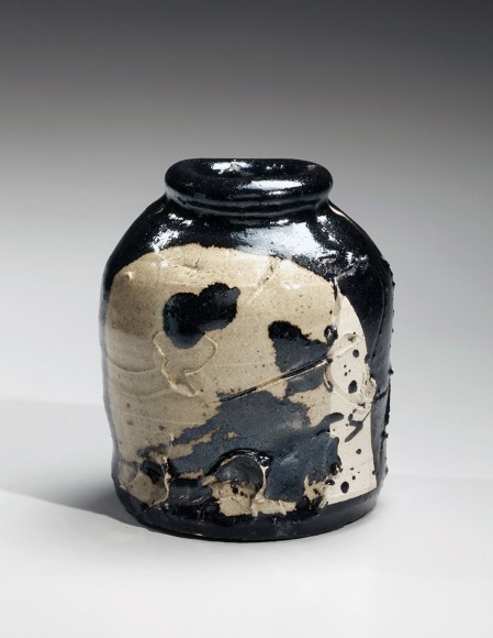 Small black and white vase with carved abstract patterning and thick mouth, ca. 1998