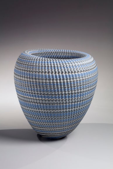 Ogata Kamio&nbsp;(b. 1949), Standing, conical, neriage (marbleized) vessel in blue, gray and white with carved, pleated surface and rolled-in mouth