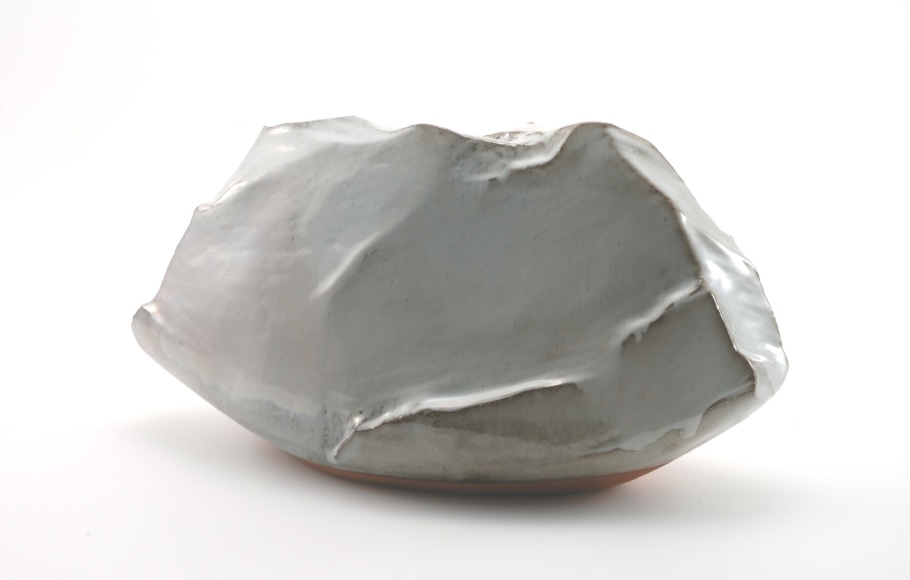 Scooped-out vessel with upturned corners covered in unctuous white Hagi glaze with pink colorations