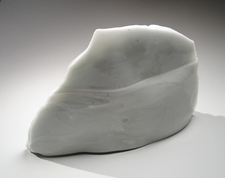 Standing abstract sculptural form that has been &ldquo;excavated&rdquo; from a larger form with molten glaze in pale green and smooth molten back; jagged mouth-like interior with embedded pre-fired porcelain; ca. 2000-2005