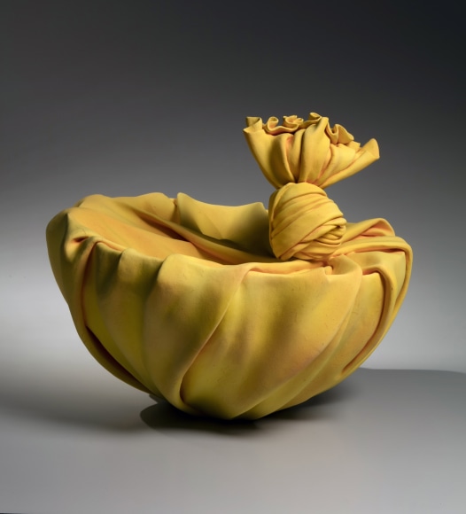Yellow sculpture in the shape of&nbsp;furoshiki&nbsp;(wrapping cloth), 2018