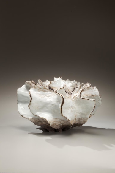 Pleated white and brown shell-shaped covered vessel with creamy white interior, 2009